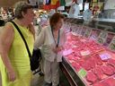 Elizabeth Leslie (right) and her friend Barb shop for angus beef at St. Lawrence Market on Wednesday. 