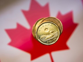 FILE PHOTO: A Canadian dollar coin, commonly known as the "Loonie", is pictured in this illustration picture taken in Toronto, January 23, 2015.    REUTERS/Mark Blinch (CANADA - Tags: BUSINESS)/File Photo ORG XMIT: FW1