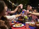 Friends make a toast to celebrate the 4th Of July holiday in the U.S.