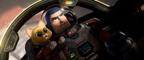 Buzz Lightyear (voice of Chris Evans) and his robot companion cat called Sox (voice of Peter Sohn) in a scene from Lightyear.