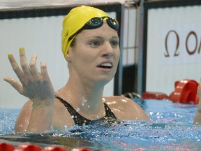 Australia's Emily Seebohm reacts after competing in a women's 100-meter backstroke swimming heat at the Aquatics Centre in the Olympic Park during the 2012 Summer Olympics in London, Sunday, July 29, 2012.