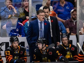Saint John Sea Dogs head coach Gardiner MacDougall yells instructions to his team at the 2022 Memorial Cup against the Hamilton Bulldogs on June 20, 2022, at Harbour Station arena in Saint John, NB.