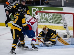 Marco Costantini (33) of the Hamilton Bulldogs makes the save against Josh Williams (14) of the Edmonton Oil Kings during the second period of the Round Robin game 5 of the 2022 Memorial Cup between the Hamilton Bulldogs vs the Edmonton Oil Kings on June 24, 2022, at the Harbour Station in Saint John, NB.