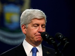 Then Michigan Governor Rick Snyder pauses as he speaks at North Western High School in Flint, a city struggling with the effects of lead-poisoned drinking water in Michigan, May 4, 2016.