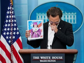 Matthew McConaughey, a native of Uvalde, Texas as well as a father and a gun owner, becomes emotional as he holds up a picture of 10-year-old victim Alithia Ramirez as he speaks to reporters during a press briefing at the White House in Washington June 7, 2022.