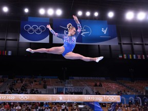 Elsabeth Black of Canada in action on the balance beam at the 2020 Tokyo Olympics. Gymnasts are among the wave of amateur athletes trying to ensure safer participation in their sport.