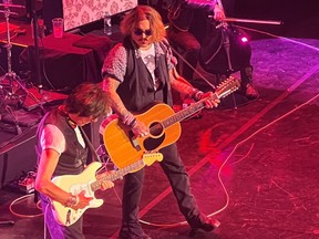 Actor Johnny Depp joins musician Jeff Beck on stage during a concert in Gateshead, Britain, on June 2, 2022 in this picture obtained by Reuters from social media.
