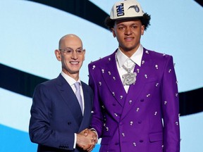 Paolo Banchero shakes hands with NBA Commissioner Adam Silver after being selected as the first overall pick by the Orlando Magic in the 2022 NBA Draft at the Barclays Center in Brooklyn, NY, Thursday, June 23, 2022.