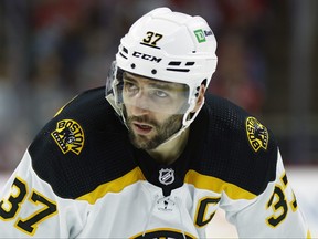 Patrice Bergeron of the Boston Bruins looks on during the third period in Game 7 of the First Round of the 2022 Stanley Cup Playoffs against the Carolina Hurricanes at PNC Arena on May 14, 2022 in Raleigh, N.C.
