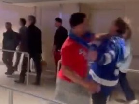 A New York Rangers fan was arrested after punching of Lightning fan was caught on video.