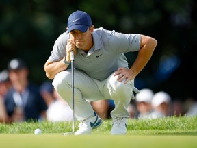 Rory McIlroy lines up a putt on the 17th green during the third round of the RBC Canadian Open on Saturday at St. George's golf club in Toronto.