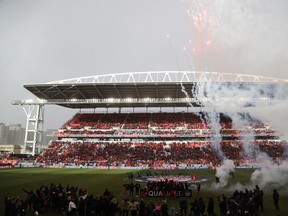 Canadian soccer fans cheer the national team's victory over Jamaica at BMO Field in Toronto on March 27, 2022.