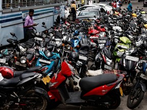 Bikes are parked in a queue to buy petrol due to fuel shortage, amid the country's economic crisis, in Colombo, Sri Lanka, June 28, 2022.