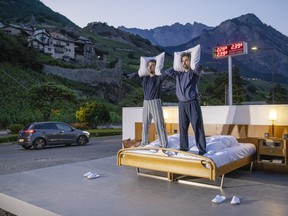 Swiss artists Frank and Patrik Riklin pose on the bed in the anti-idyllic suite of the Null-Stern-Hotel (Zero-Star-Hotel), offering guests a choice between four open-air rooms in reaction to the world current state after the pandemic, in Saillon, Switzerland June 14, 2022.