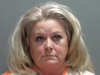 Laurie Hinds, 51, allegedly spat on a corpse.(Wood County Jail)