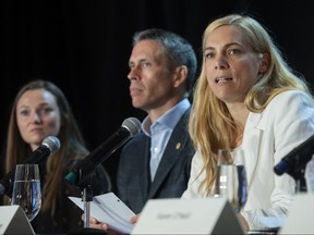 Minister of Sport Pascale St-Onge ( right) with Olympic athlete Rosie MacLennan and COC CEO David Shoemaker, speaks during a news conference in Montreal on June 12, 2022.