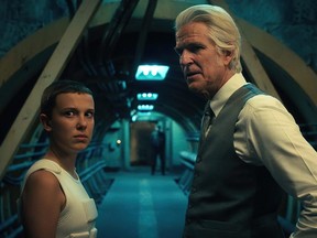 Millie Bobby Brown as Eleven and Matthew Modine as Dr. Martin Brenner in Stranger Things.