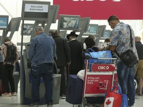 Passengers will go through the Customs process at Pearson Airport Terminal One on May 25, 2022.