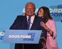 Doug Ford and his wife Karla on stage at the Toronto Congress Center for their victory speech after winning a majority in provincial elections on June 2, 2022. 