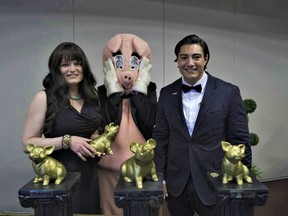 Canadian Taxpayer Federation's Alberta director Kris Sims, Porky the Waste Hater, and federal director Franco Terrazzano hand out Teddy Awards in Calgary.