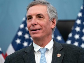 In this file photo taken on Feb. 3, 2022, Representative Tom Rice (R-C) addresses reporters during a press conference to unveil the Joseph H. Rainey Room in the in the U.S. Capitol in Washington, D.C.