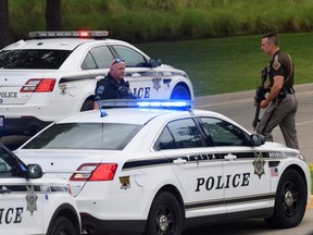 Emergency personnel work at the scene of a shooting at the Warren Clinic in Tulsa, Oklahoma, Wednesday, June 1, 2022.