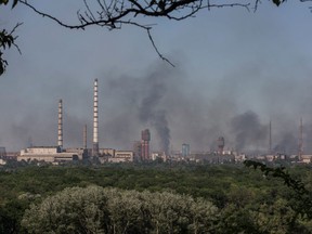 Smoke rises after a military strike on a compound of the Sievierodonetsk's Azot Chemical Plant amid Russia's attack on Ukraine continues, in the town of Lysychansk, Luhansk region, Ukraine June 10, 2022.