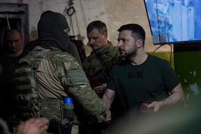 Ukraine’s President Volodymyr Zelenskyy awards a soldier as he visits a position of Ukrainian service members, while Russia’s attack on Ukraine continues, in Lysychansk, Luhansk region, Ukraine, June 5, 2022.