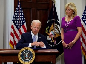 U.S. President Joe Biden prepares to sign S. 2938: Bipartisan Safer Communities Act into law from the Roosevelt Room at the White House, in Washington, D.C., June 25, 2022.