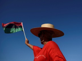 A person waves a flag during an emancipation march as people gather to celebrate Juneteenth, which commemorates the end of slavery in Texas, two years after the 1863 Emancipation Proclamation freed slaves elsewhere in the United States, in Galveston, Texas, June 19, 2022.