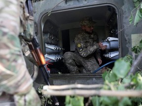 Ukrainian artillery men fire from their positions near the city of Lysychansk, Luhansk region on Tuesday, June 14, 2022.