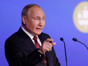 Russian President Vladimir Putin delivers a speech during the St. Petersburg International Economic Forum in Saint Petersburg, Russia, Friday, June 17, 2022.