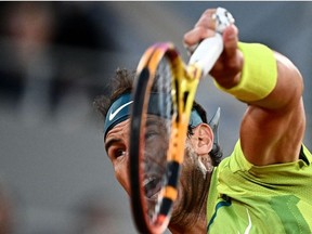 Spain's Rafael Nadal serves to Serbia's Novak Djokovic during their men's quarter-final singles match on day ten of the Roland-Garros Open tennis tournament at the Court Philippe-Chatrier in Paris on May 31, 2022.