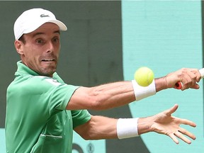 Spain's Roberto Bautista Agut returns the ball to Russia's Daniil Medvedev reacts (not pictured) during the men's singles quarter final match at the ATP 500 Halle Open tennis tournament in Halle, western Germany, on June 17, 2022.