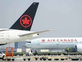 Air Canada planes sit on the tarmac at Pearson International Airport during the COVID-19 pandemic in Toronto, April 28, 2021.