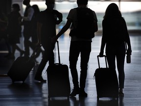 Travellers walk through the Terminal 1 departures level at Toronto Pearson International Airport on Tuesday, June 14, 2022.