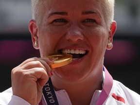 Gold medalist Anita Wlodarczyk, of Poland, poses during the medal ceremony for the women's hammer throw at the 2020 Summer Olympics, Aug. 4, 2021, in Tokyo, Japan.