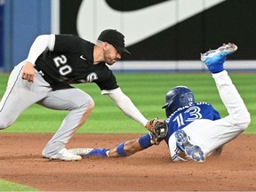 Jun 1, 2022; Toronto, Ontario, CAN; Chicago White Sox shortstop Danny Mendick (20) tags out Toronto Blue Jays right fielder Teoscar Hernandez (37) on an attempted steal of second base in the fifth inning at Rogers Centre.