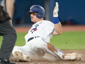 Toronto Blue Jays third baseman Matt Chapman slides into home plate scoring a run against the Chicago White Sox during the eighth inning at Rogers Centre.
