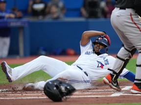 Toronto Blue Jays first baseman Vladimir Guerrero Jr. (27) is safe at home during first inning American League MLB baseball action against the Baltimore Orioles in Toronto on Wednesday, June 15, 2022.