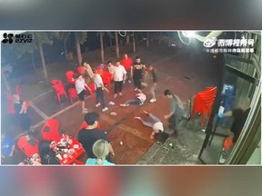 A man sparks a brawl outside a restaurant in a graphic video that has gone viral in China.