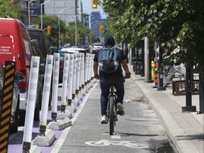 The Danforth bike lanes (pictured - looking westward) project, which are getting a further extension eastward from Dawes Rd. towards Victoria Park Ave., are seen here on Friday, June 10, 2022.