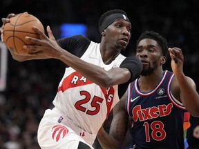Toronto Raptors forward Chris Boucher looks for the pass as Philadelphia 76ers guard Shake Milton pressures during first half NBA action in Toronto, April 28, 2022.