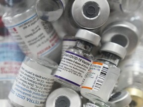 A jar full of empty COVID-19 vaccine vials is shown at the Junction Chemist pharmacy during the COVID-19 pandemic in Toronto, April 6, 2022.