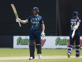 Cricket - One Day International - Netherlands v England - VRA Cricket Amsterdam, Amstelveen, Netherlands - June 17, 2022
England's Jos Buttler celebrates one hundred fifty runs