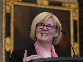 Employment, Workforce Development and Disability Inclusion Minister Carla Qualtrough smiles as she speaks to media after tabling a bill in the House of Commons Thursday, June 2, 2022 in Ottawa.