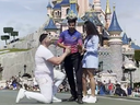 Disneyland Paris employee stepping between couple in the middle of a marriage proposal.