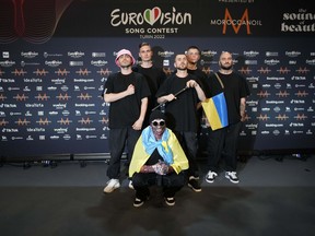 Kalush Orchestra of Ukraine pose for photographers after winning the Grand Final of the Eurovision Song Contest at Palaolimpico arena, in Turin, Italy, Sunday, May 15, 2022.