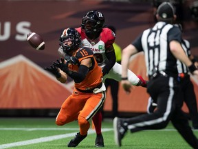 B.C. Lions' Bryan Burnham (16) makes the reception in the end zone to score a touchdown as Ottawa Redblacks' Brad Muhammad defends during the first half of a CFL football game in Vancouver, on Saturday, September 11, 2021.