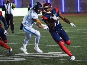 Oct 22, 2021; Montreal, Quebec, CAN; Montreal Alouettes wide receiver Eugene Lewis (87) runs with the ball against the Toronto Argonauts in the third quarter during a Canadian Football League game at Molson Stadium.